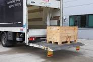 7 ton truck with a wooden box on it.