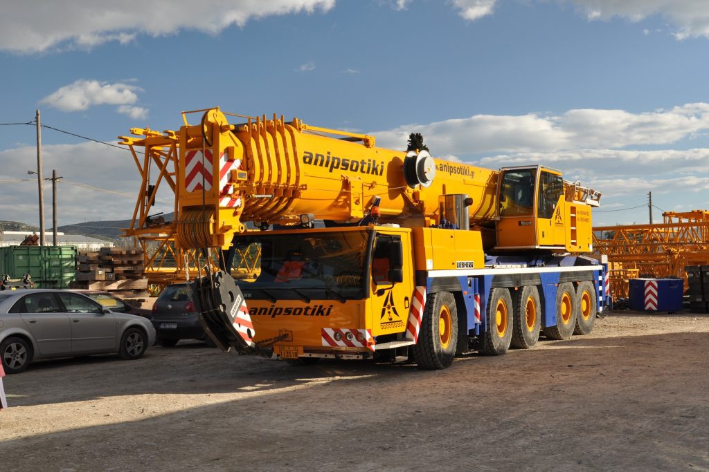 mobile crane on road with yellows colour